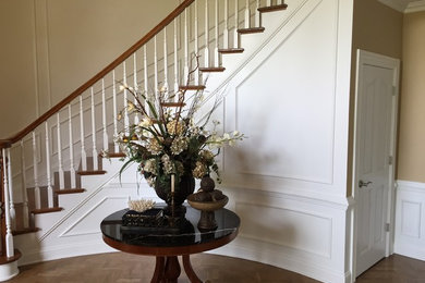 Inspiration for a mid-sized timeless wooden curved staircase remodel in Louisville with painted risers