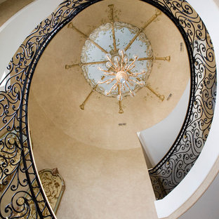 Inspiration for a huge timeless wooden curved staircase remodel in Chicago with painted risers