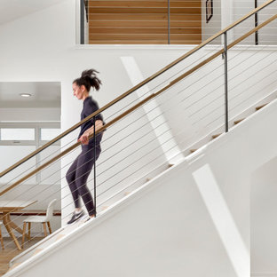 Example of a minimalist wooden straight mixed material railing staircase design in San Francisco with wooden risers
