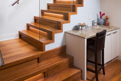 Design ideas for a medium sized contemporary wood l-shaped metal railing staircase in Calgary with wood risers.