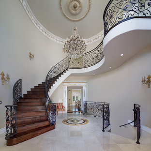 Example of a large tuscan staircase design in Los Angeles