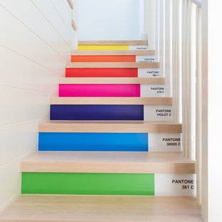 Design ideas for a contemporary wood straight staircase in Channel Islands with painted wood risers.