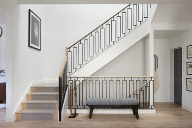 Inspiration for a transitional carpeted l-shaped mixed material railing staircase remodel in San Francisco with carpeted risers