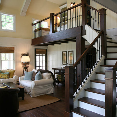 Inspiration for a mid-sized timeless wooden l-shaped metal railing staircase remodel in Milwaukee with painted risers