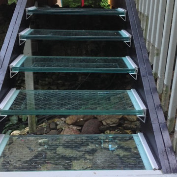 Laminated glass steps in an outdoor deck system