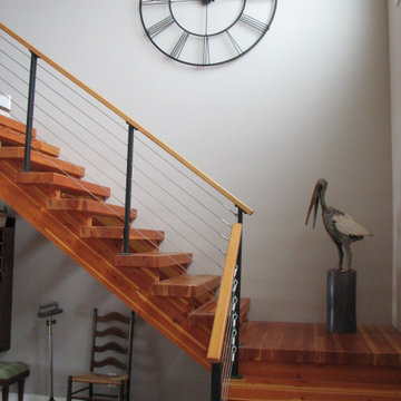 Large wall clock, cable railing, open glu-lam stairs