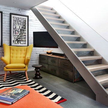 LGF living room with feature glass and steel open tread staircase