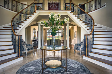 Inspiration for a large contemporary wooden curved staircase remodel in Nashville with painted risers