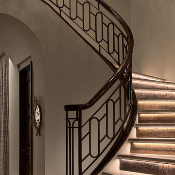 Lighted Stone Stair Treads with Iron Balustrade
