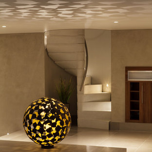 Small minimalist concrete spiral staircase photo in Other