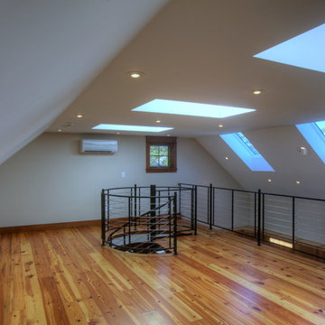 loft space open to lower floor with spiral staircase
