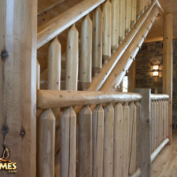 Log stairway and log railings in a Golden Eagle log home Lakehouse 4166AL