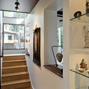 Trendy wooden staircase photo in Seattle with wooden risers