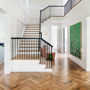 Inspiration for a huge transitional wooden u-shaped metal railing staircase remodel in Dallas with painted risers