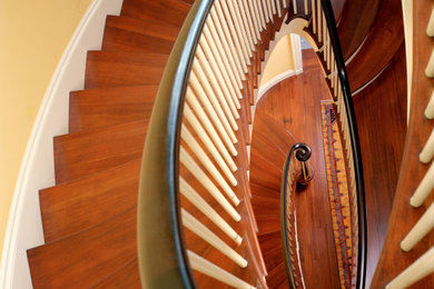 Inspiration for a large timeless wooden spiral wood railing staircase remodel in Boston with wooden risers