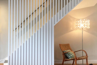 Design ideas for a scandinavian staircase in London with feature lighting.