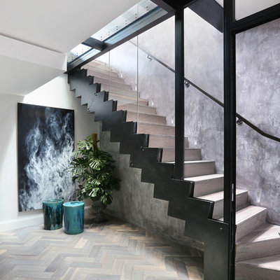Inspiration for a contemporary wooden l-shaped staircase remodel in London with wooden risers