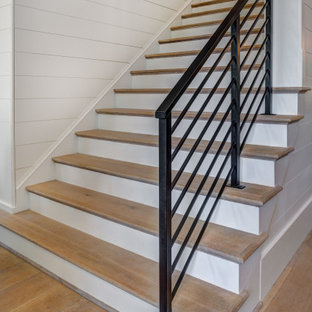 Staircase - large farmhouse wooden straight metal railing staircase idea in Charlotte with painted risers