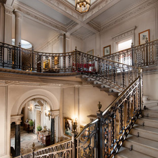 This is an example of a traditional u-shaped metal railing staircase in Other.