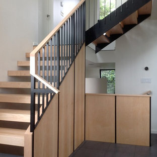 Example of a large minimalist wooden floating open staircase design in Seattle