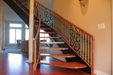 Inspiration for a timeless wooden open staircase remodel in DC Metro