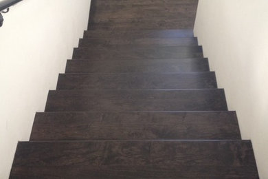Inspiration for a large transitional wooden straight staircase remodel in Los Angeles with wooden risers