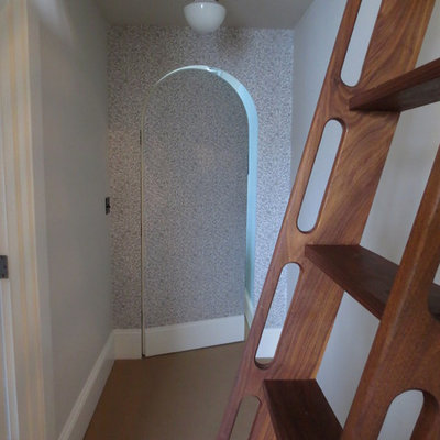 Mid-sized eclectic wooden open staircase photo in Portland