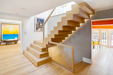 Example of a mid-sized trendy wooden l-shaped staircase design in Toronto with wooden risers