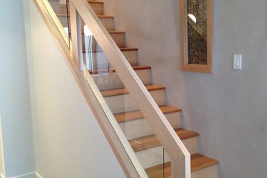 Staircase - mid-sized modern wooden straight staircase idea in Edmonton with wooden risers