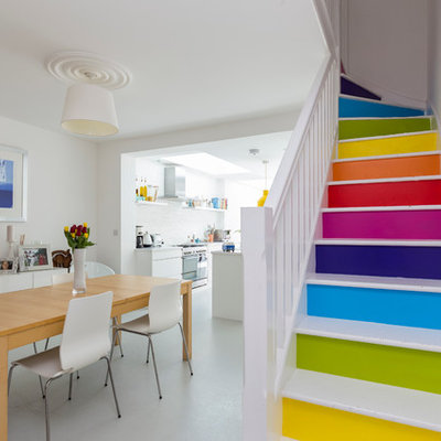 Trendy painted l-shaped staircase photo in London with painted risers