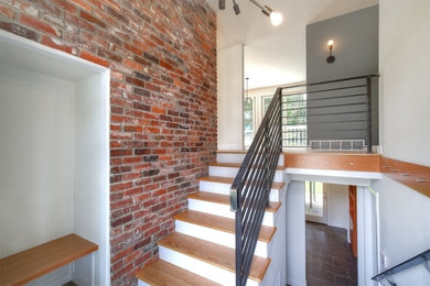 Example of a mid-sized 1960s wooden u-shaped staircase design in Seattle with painted risers