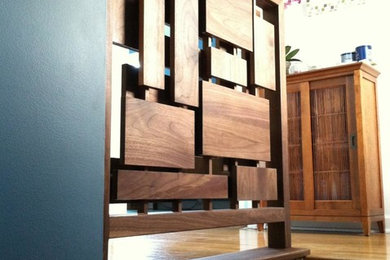 Esempio di una piccola scala minimalista con pedata in legno e alzata in legno
