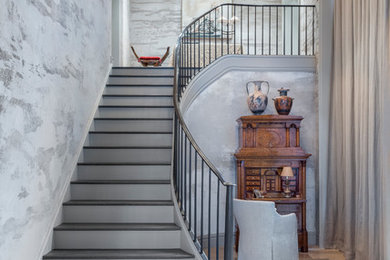 Inspiration for a mediterranean curved metal railing staircase in New York.