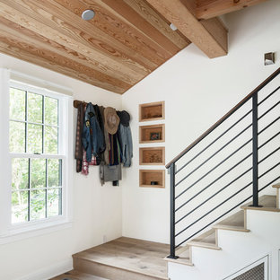 Inspiration for a country wooden straight metal railing staircase remodel in Austin with wooden risers