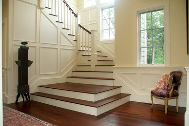 Staircase - mid-sized traditional wooden l-shaped staircase idea in Boston with painted risers