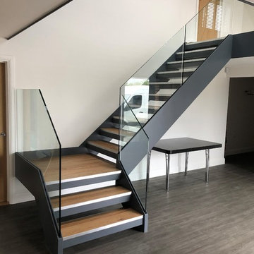 Minimilistic Channelled Stringer Staircase with Frameless Glass