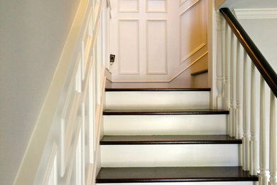Example of a large classic wooden l-shaped staircase design in San Diego with painted risers