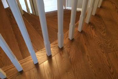 Mississauga hardwood stairs reno with square white spindles - showing curved nos