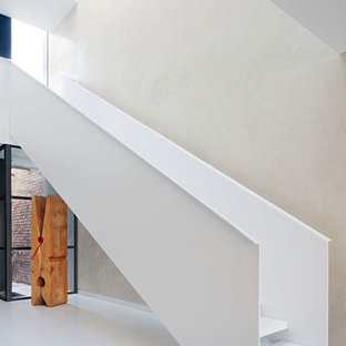 Photo of a contemporary straight staircase in Melbourne with open risers and metal railing.