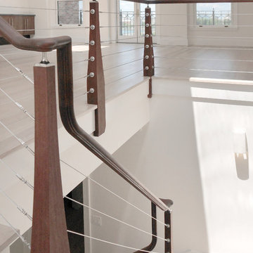 modern dark wood staircase with wire cables