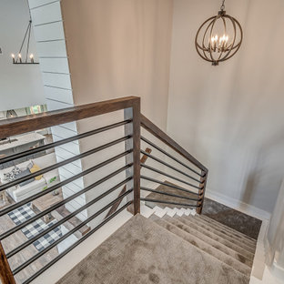 Inspiration for a large country carpeted u-shaped metal railing and shiplap wall staircase remodel with carpeted risers
