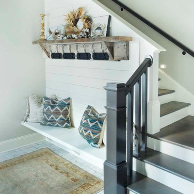 Mid-sized country painted l-shaped staircase photo in Nashville with painted risers