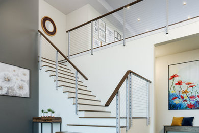 Inspiration for a modern cable railing staircase remodel in Vancouver