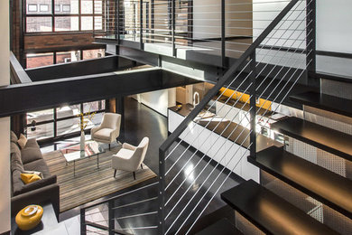 Staircase - industrial mixed material railing staircase idea in Chicago