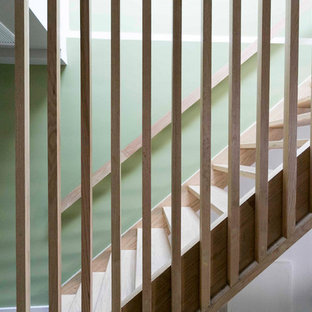 Staircase - mid-sized modern wooden straight open and wood railing staircase idea in New York