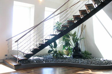 Large modern wood curved staircase in Chicago with open risers.