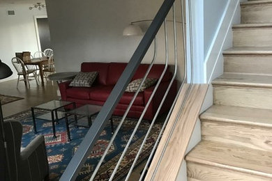Modern wood straight staircase in Baltimore with wood risers.