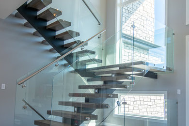Staircase - large modern wooden u-shaped open and glass railing staircase idea in Other