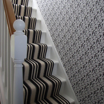 monochrome striped stair carpet runner and patterned wallpaper