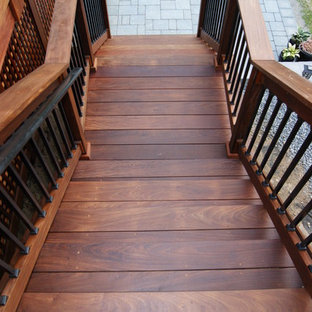 Inspiration for a mid-sized timeless wooden straight staircase remodel in New York with wooden risers